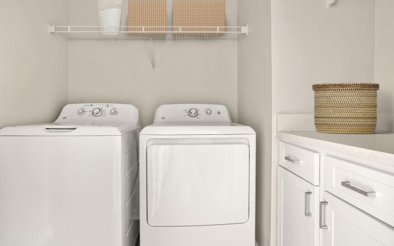 a laundry room with a washer and dryer